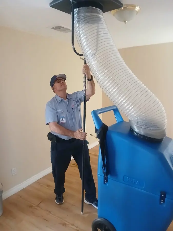 Furnace Tune-Up technician using HEPA equipment in Pueblo West